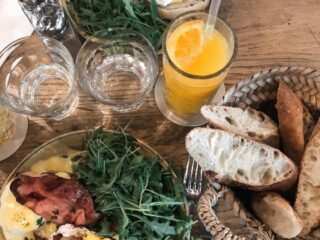foods and juice served on brown table