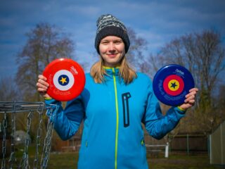 woman holding discs