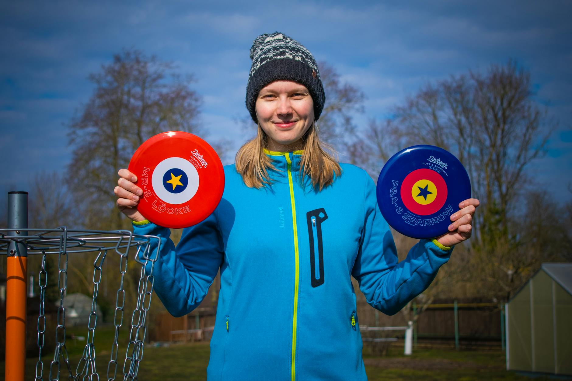 woman holding discs